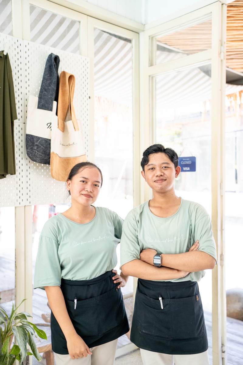 Mowie's Bali team in branded aprons at the front of the cafe
