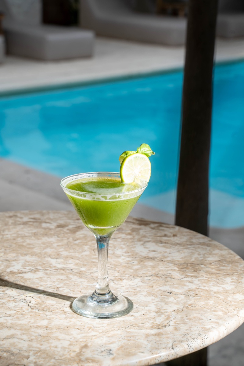 House matcha cocktail poolside at Mowie's