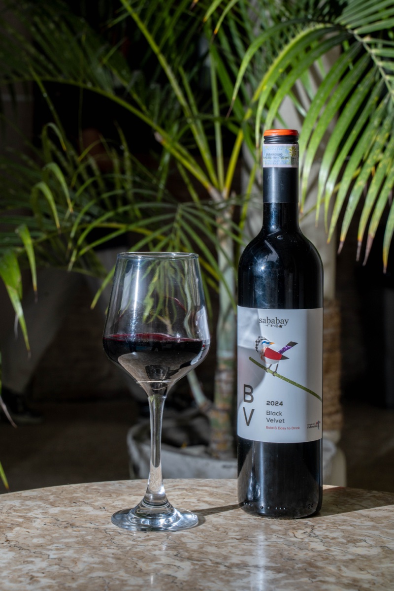 Black Velvet red wine bottle and glass